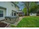 Expansive backyard features a hot tub, gazebo, storage shed, and mature trees; perfect for entertaining and relaxation at 218 Candleberry Cir, Goose Creek, SC 29445