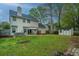A large backyard features a hot tub, gazebo, utility shed, and mature trees surrounding the lawn at 218 Candleberry Cir, Goose Creek, SC 29445