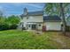 Backyard with a hot tub, patio, gazebo, lush lawn and a house with beige siding at 218 Candleberry Cir, Goose Creek, SC 29445