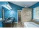 This bathroom is equipped with a double sink vanity, soaking tub, and step-in shower at 218 Candleberry Cir, Goose Creek, SC 29445