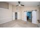 Spacious bedroom featuring large windows, ceiling fan, and sliding barn doors to the bath at 218 Candleberry Cir, Goose Creek, SC 29445