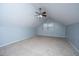 This carpeted bedroom has gray walls, a ceiling fan and a window for natural light at 218 Candleberry Cir, Goose Creek, SC 29445
