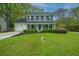 Traditional two-story home with attached garage and lush green lawn at 218 Candleberry Cir, Goose Creek, SC 29445