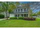 Charming two-story home boasts a well-manicured lawn and inviting front porch at 218 Candleberry Cir, Goose Creek, SC 29445
