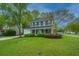 Charming two-story home with well-manicured lawn and landscaping, complemented by a double garage and inviting entrance at 218 Candleberry Cir, Goose Creek, SC 29445