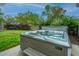Enjoy the outdoor space with this Hot Spring hot tub and beautiful surrounding greenery at 218 Candleberry Cir, Goose Creek, SC 29445