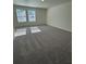 A bedroom with carpeting and two windows at 2405 Scarlett Maple St, Summerville, SC 29486