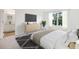 Well-lit bedroom featuring hardwood floors, a window with a view, and a spacious layout at 2405 Scarlett Maple St, Summerville, SC 29486