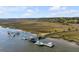Overhead view of private docks in the marsh leading to deep water with ample space for boating at 2410 Kemway Rd, Johns Island, SC 29455