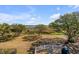 Elevated deck view showcasing a manicured lawn, marshland, and distant water under a partly cloudy sky at 2410 Kemway Rd, Johns Island, SC 29455
