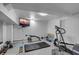 Finished basement featuring workout equipment, a TV, and a grey floor at 2410 Kemway Rd, Johns Island, SC 29455