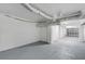 Spacious basement with grey floor, white walls, exposed ductwork, and access to the garage at 2410 Kemway Rd, Johns Island, SC 29455