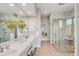 Bright bathroom with double vanity, walk-in shower, and tile flooring at 2410 Kemway Rd, Johns Island, SC 29455