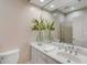 Bright bathroom with white vanity and sink, a large mirror, white walls, and recessed lighting at 2410 Kemway Rd, Johns Island, SC 29455