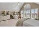 Bedroom featuring vaulted ceiling, large window with shutter blinds, and built-in shelves and cabinets at 2410 Kemway Rd, Johns Island, SC 29455