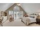 Bedroom featuring vaulted ceiling, large window with shutter blinds, and built-in shelves and cabinets at 2410 Kemway Rd, Johns Island, SC 29455