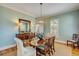 Formal dining room with a wooden table, decorative chandelier, and light blue walls at 2410 Kemway Rd, Johns Island, SC 29455