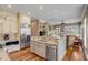 Open concept kitchen with stainless steel appliances, granite countertops, and island seating at 2410 Kemway Rd, Johns Island, SC 29455
