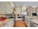Well-appointed kitchen with stainless steel appliances, granite countertops, and hardwood floors at 2410 Kemway Rd, Johns Island, SC 29455