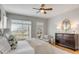 Peaceful main bedroom with a view, wood floors, and a cozy chair at 2410 Kemway Rd, Johns Island, SC 29455