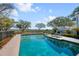 Backyard pool with lounge chairs and tranquil water view at 2410 Kemway Rd, Johns Island, SC 29455
