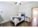 Neutral bedroom featuring hardwood floors, a ceiling fan and a single bed with cozy blankets at 2447 Louisville St, Charleston, SC 29492