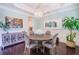 Dining room with hardwood floors, chandelier, and views to the kitchen at 2447 Louisville St, Charleston, SC 29492