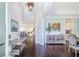 Bright entryway features hardwood floors and views into the living and dining spaces at 2447 Louisville St, Charleston, SC 29492