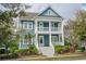Charming two-story home featuring a spacious porch and a beautifully landscaped front yard at 2447 Louisville St, Charleston, SC 29492
