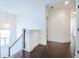 Second floor hallway features hardwood floors, white walls, a stairwell, and modern lighting at 2447 Louisville St, Charleston, SC 29492