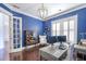 Bright home office with blue walls, a desk, chair, and white trim at 2447 Louisville St, Charleston, SC 29492