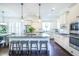 Bright kitchen with granite counters, stainless appliances, large island, and dark hardwood flooring at 2447 Louisville St, Charleston, SC 29492