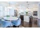 Open kitchen featuring stainless steel appliances, white cabinetry, and an island with bar seating at 2447 Louisville St, Charleston, SC 29492