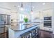 Kitchen featuring stainless steel appliances, granite countertops, large island, and hardwood floors at 2447 Louisville St, Charleston, SC 29492