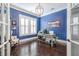 Office space featuring a dark blue accent wall, hardwood flooring, and a chair at 2447 Louisville St, Charleston, SC 29492