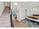Open-concept dining area flows from the stairs, adjacent to the kitchen, with views to the backyard at 260 Dunlin Dr, Summerville, SC 29486