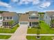 Charming two-story home featuring a well-manicured lawn, a two-car garage, and classic black shutters at 260 Dunlin Dr, Summerville, SC 29486