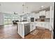 Open concept kitchen with white cabinetry, modern appliances, center island, and view into the living room at 260 Dunlin Dr, Summerville, SC 29486