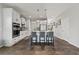 Modern kitchen with white cabinets, granite countertops, stainless steel appliances, and a center island with seating at 260 Dunlin Dr, Summerville, SC 29486