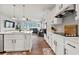 Spacious kitchen with white cabinets, granite countertops, stainless steel appliances, and open view into the living room at 260 Dunlin Dr, Summerville, SC 29486