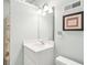 Bathroom with updated vanity, framed mirror, decorative lighting, and neutral tones at 2737 Old Forest Dr, Seabrook Island, SC 29455