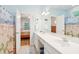 Bright bathroom with double vanity, full mirror, and coastal-themed decor at 2737 Old Forest Dr, Seabrook Island, SC 29455
