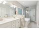 Bright bathroom features a double vanity, soaking tub with shower, and tiled floors at 2737 Old Forest Dr, Seabrook Island, SC 29455