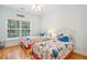 Charming bedroom with two twin beds, hardwood floors, and light blue walls at 2737 Old Forest Dr, Seabrook Island, SC 29455