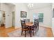 Traditional dining room with hardwood floors, six chairs, and bright natural light at 2737 Old Forest Dr, Seabrook Island, SC 29455