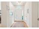 Bright entryway featuring hardwood floors, neutral walls, and transom windows providing natural light at 2737 Old Forest Dr, Seabrook Island, SC 29455