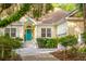 Welcoming exterior showcasing the front door, lush landscaping, and charming details at 2737 Old Forest Dr, Seabrook Island, SC 29455