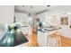 Well-lit kitchen featuring granite countertops, white cabinets, stainless steel appliances, and open layout at 2737 Old Forest Dr, Seabrook Island, SC 29455