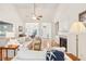 Inviting living room featuring a vaulted ceiling, fireplace, hardwood floors, and comfortable seating arrangement at 2737 Old Forest Dr, Seabrook Island, SC 29455