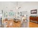 Airy living room featuring hardwood floors, high ceilings, and a comfortable seating arrangement at 2737 Old Forest Dr, Seabrook Island, SC 29455
